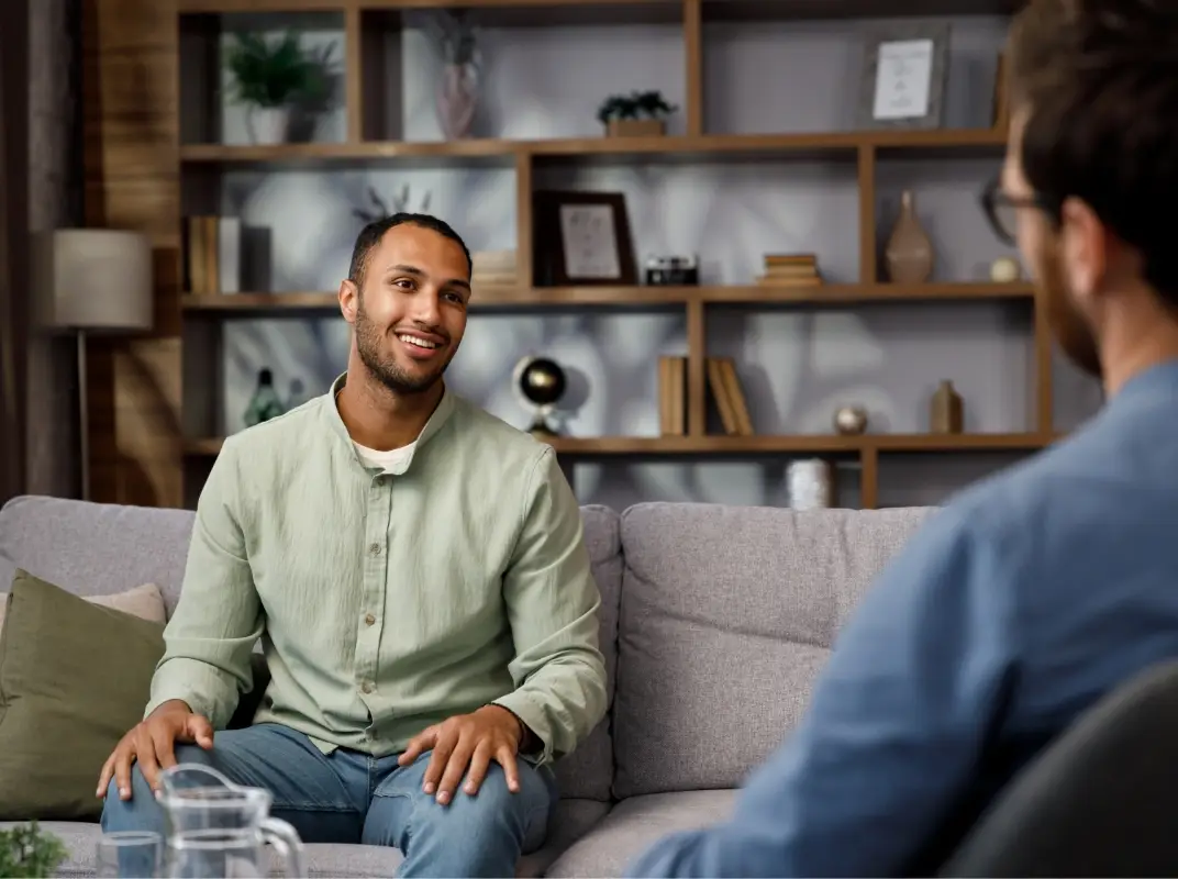 Person sat in a Psychological Therapy session with a specialist practitioner.