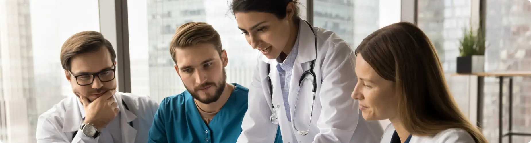 A doctor providing consultation in a clinical setting.